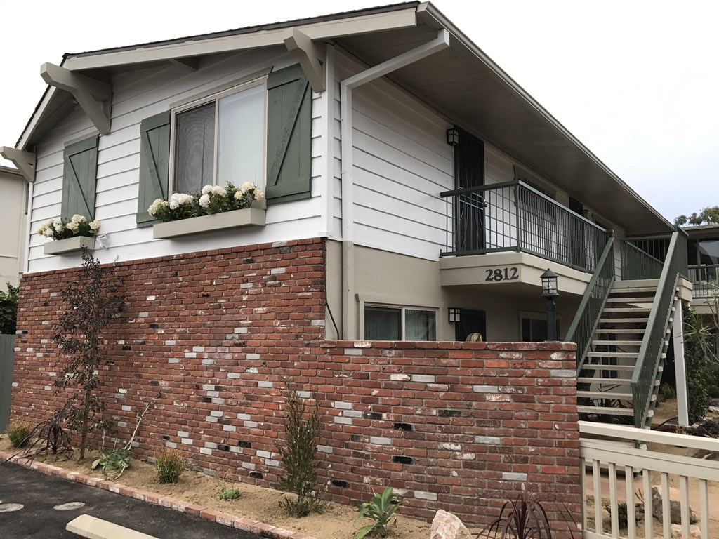 Windows with garden boxes at Harbor Villa Apartments in San Diego, California.