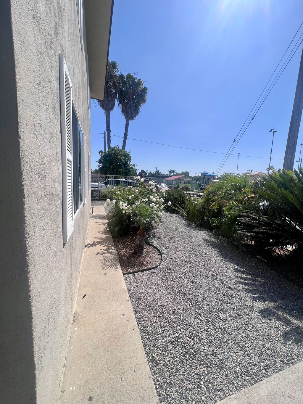View of front yard landscaping at Higgins Street Apartments in Oceanside, California.