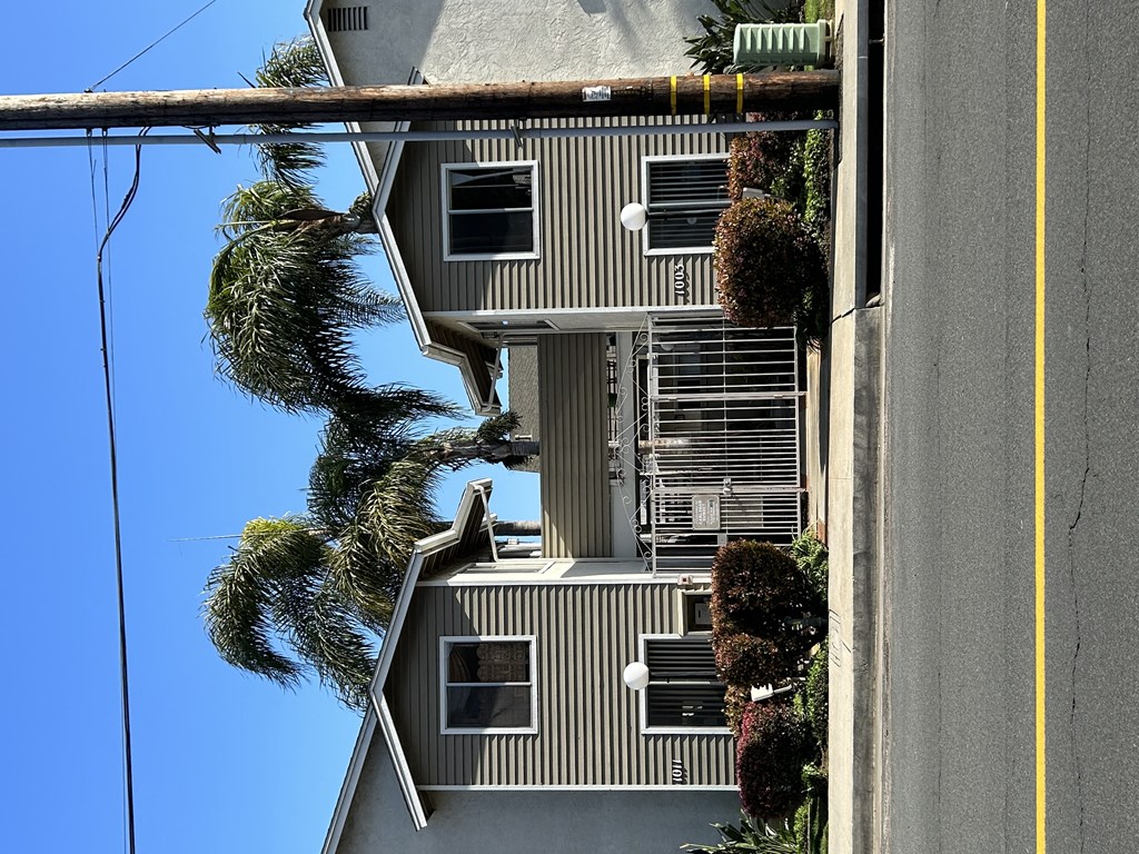 Street view of gated community at Carlsbad Sunset Apartments in Carlsbad, California.