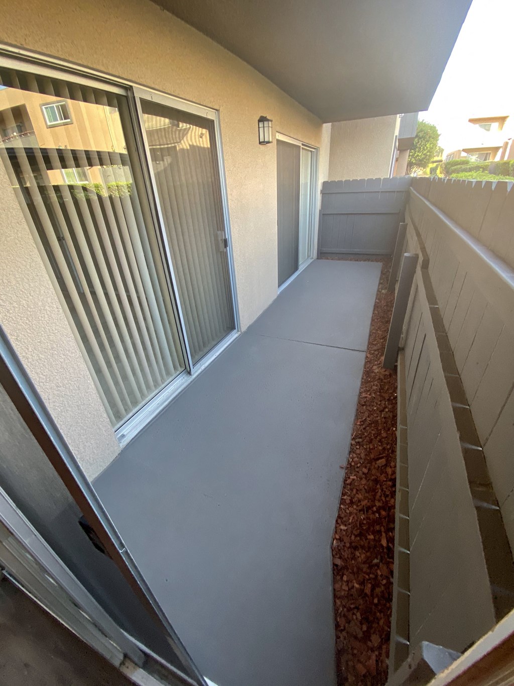 Private porch with access from master bedroom and living room at Villa Pacific Apartments in Oceanside, California.