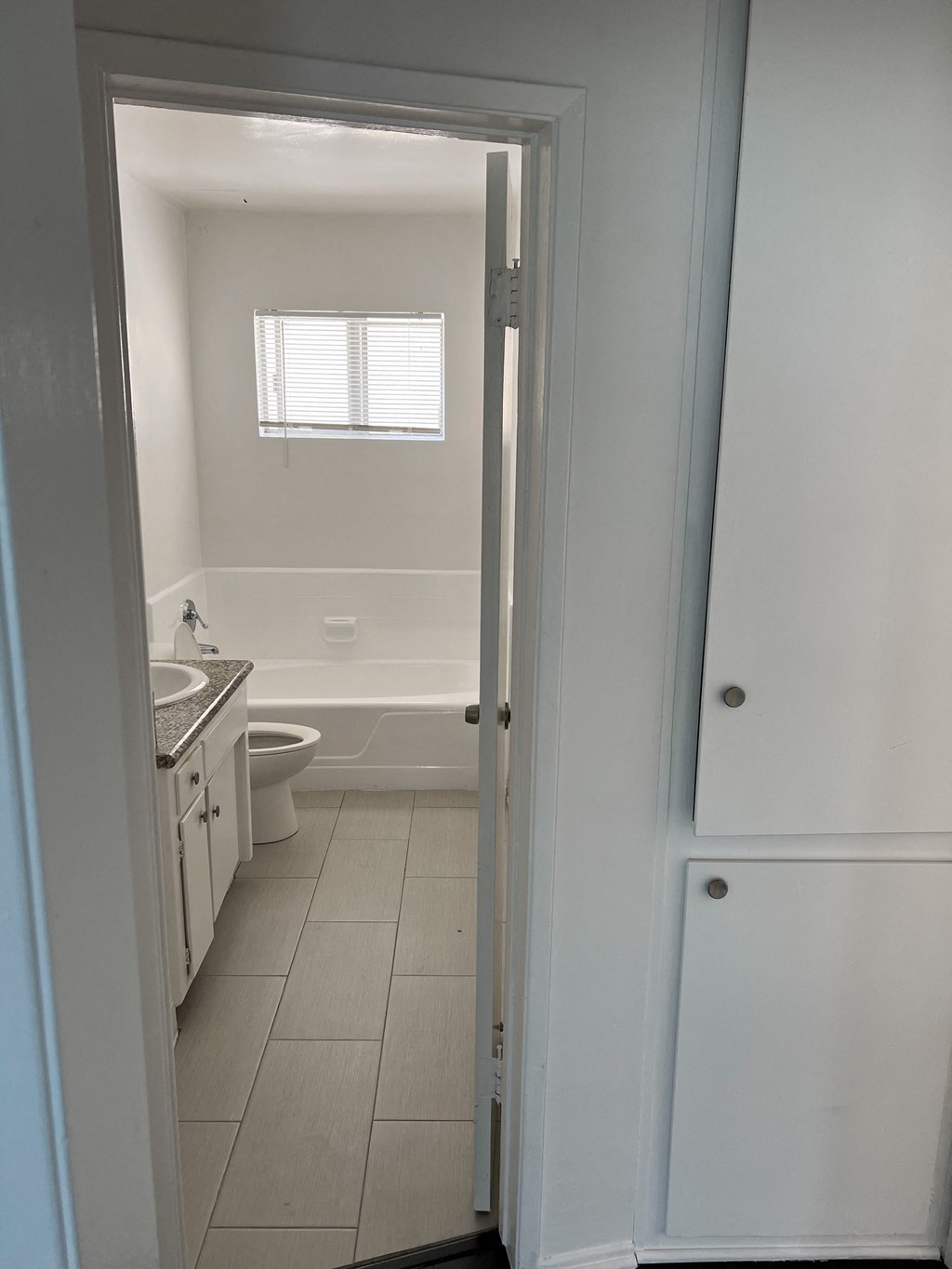 Nice white bathroom with natural light in apartment at The Carlton in Hollywood, California.