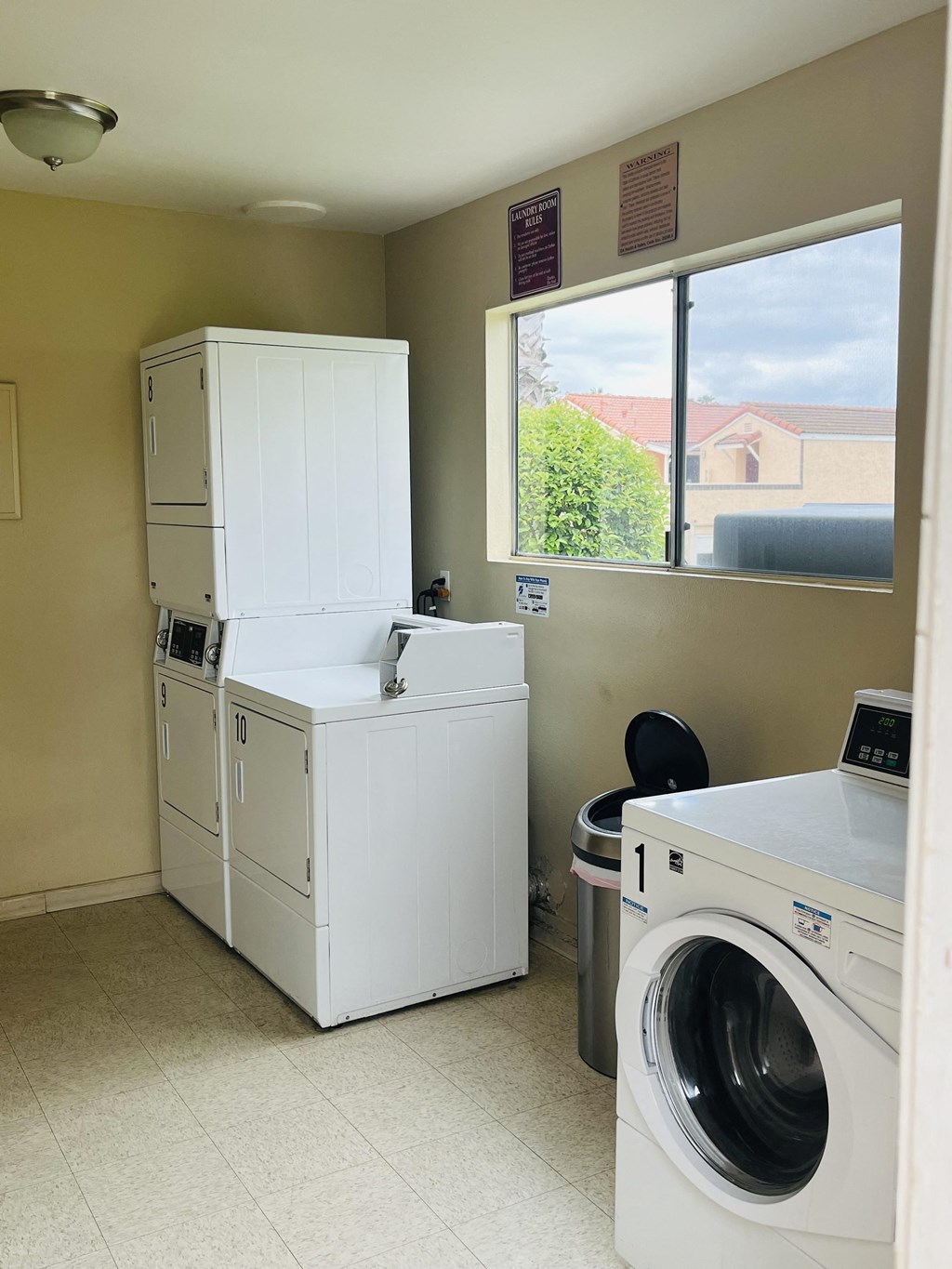 Laundry facilities in apartment building at Plaza Verde Apartments in Escondido, California.