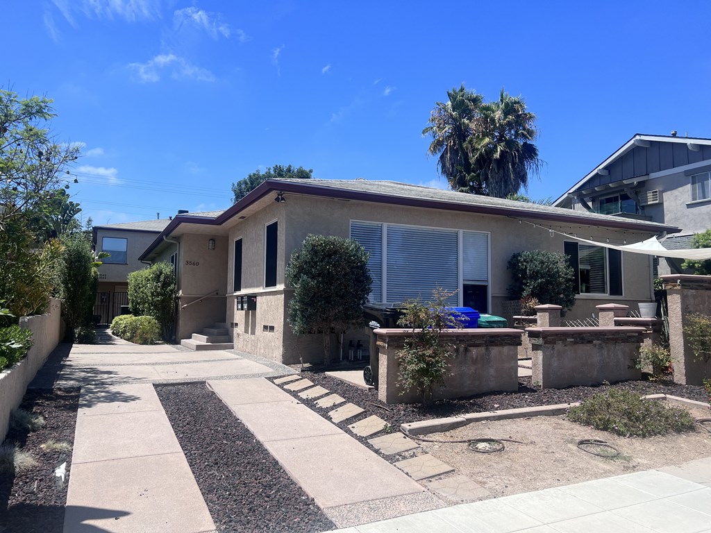 View of front yard and porch of Herman Avenue Apartments in the North Park area of San Diego, California.