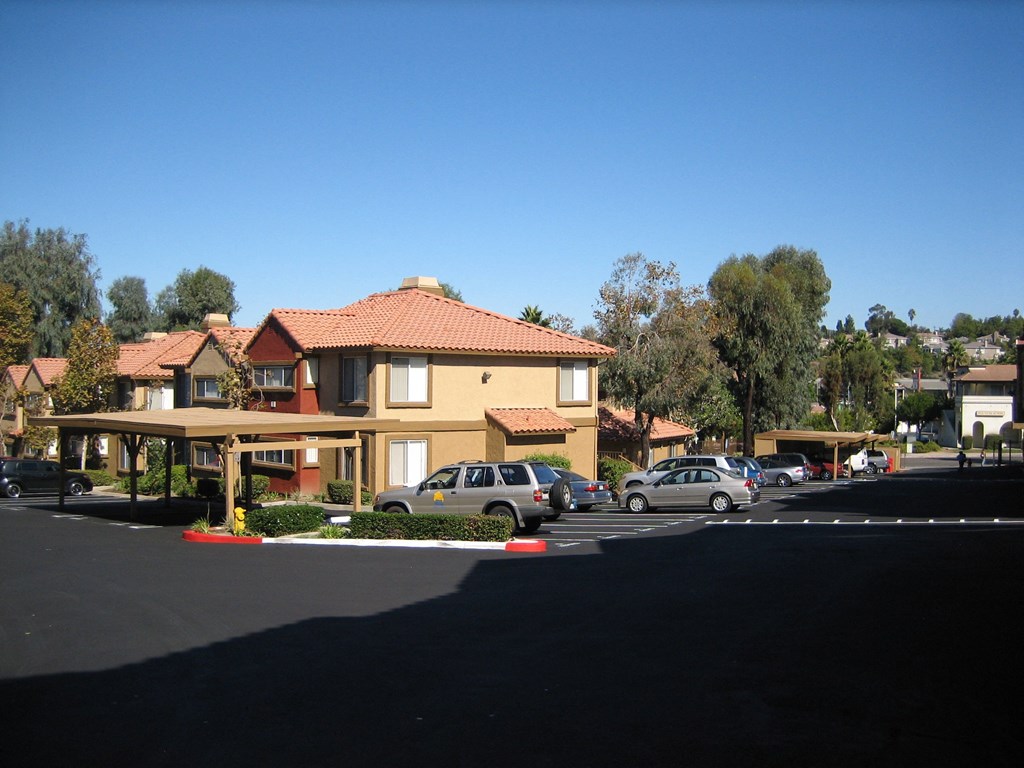 Beautiful apartment townhomes surrounded by mature landscaping and plenty of parking options at Grande Vista Apartments.