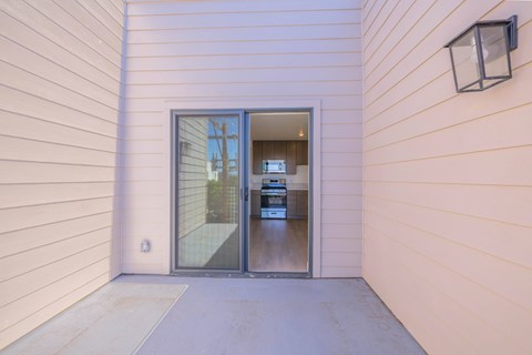 A modern house with a glass door entrance.