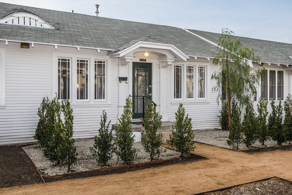 Inviting landscaping around front porch of apartment home at 4141 Normal Avenue in Los Angeles, California.