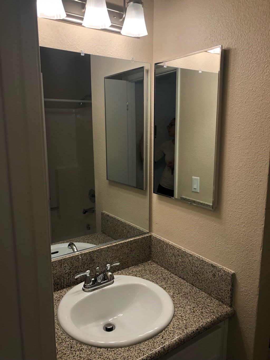 Hallway view into bathroom at Grande Vista Apartments.