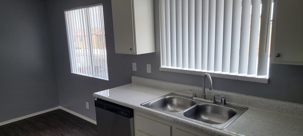 Lots of natural light in the kitchen and dining room at Grand Oaks Apartments in Lake Elsinore, California.