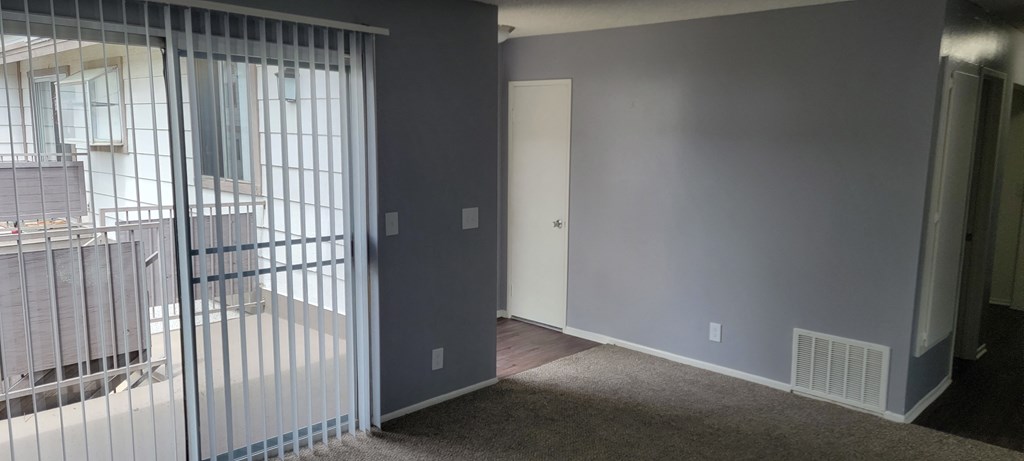 Front enterance living room and hallway to bedrooms and bathroom at Grand Oaks Apartments in Lake Elsinore, California.