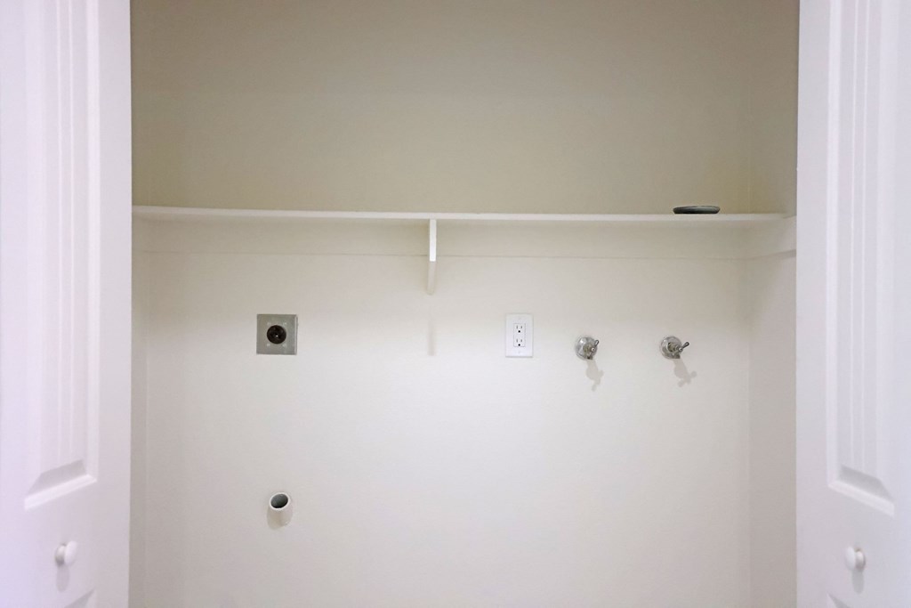 Upstairs washer/dryer hookups at Lone Pine Townhomes in El Cajon, California.