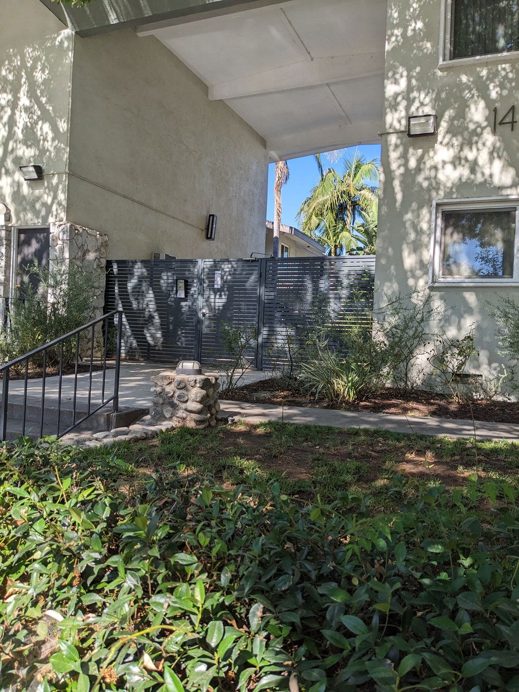 Privacy gate to innear courtyard, pool, and apartment enterances at Los Robles Apartments in Pasadena, California.