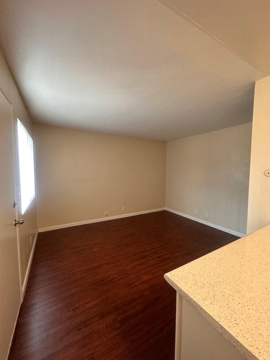 A view of the living room from the kitchen at The Meadowlark Apartments.