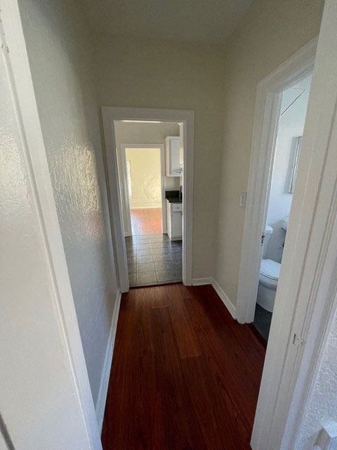 Hallway to bathroom and bedroom in apartment unit of Moliino Del Mar Apartments in Pasadena, California.