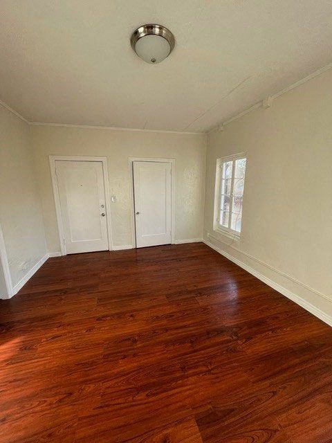 Beautiful hardwood flooring in living room at Molino Del Mar Apartments in Pasadena, California.