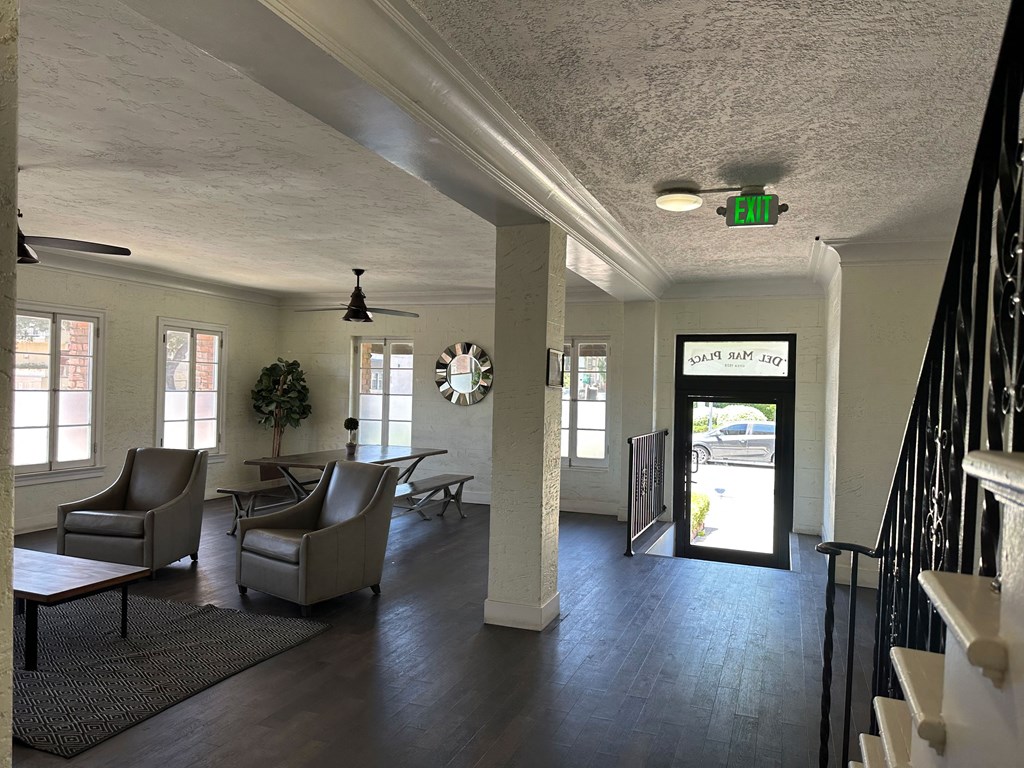 Front door in lobby and stairs to second floor units at Molino Del Mar Apartments in Pasadena, California.