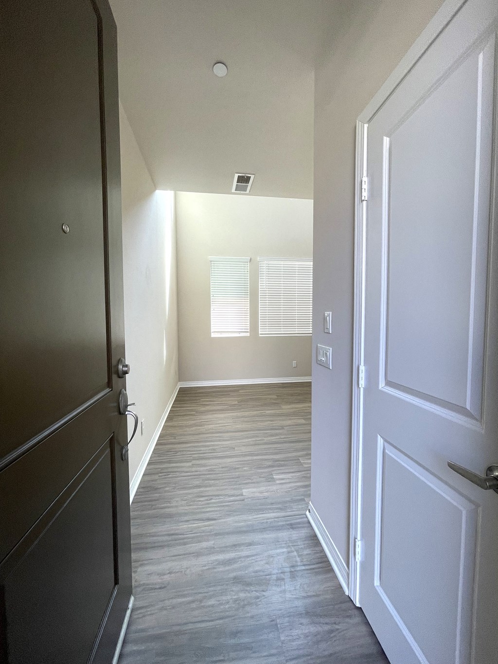 Neptune unit entry hallway at Costa Pointe in Carlsbad, California.
