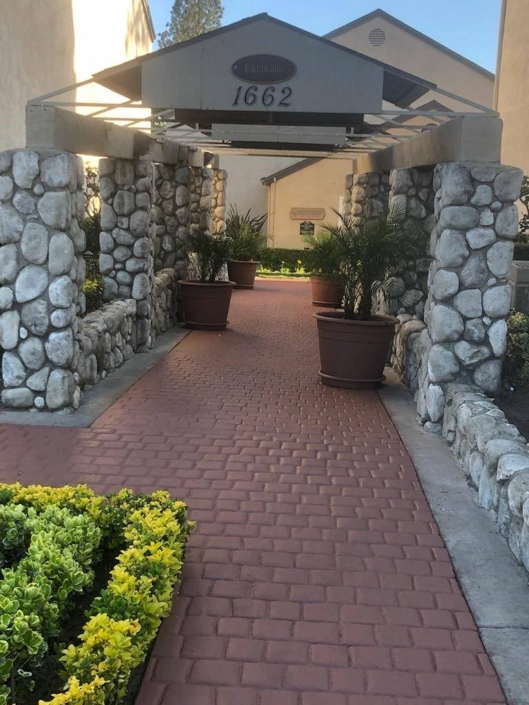 Quaint brick walkway enterance to Northwood Apartments in Upland, California.