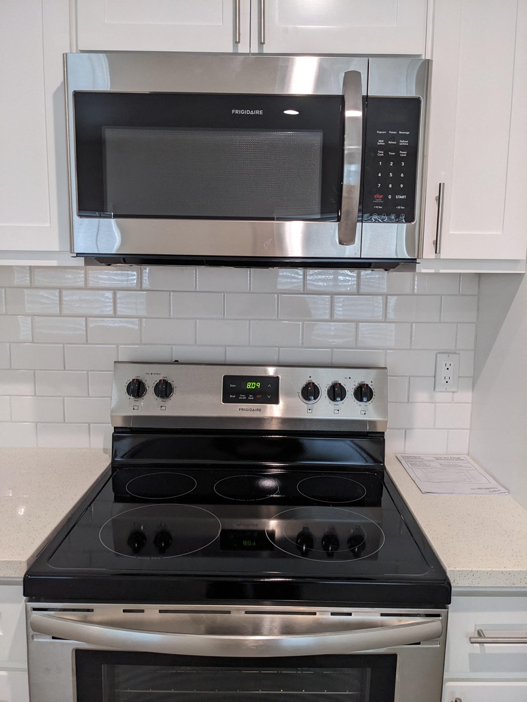 Upscale electric range and micorwave at The Hardison Apartments in Pasadena, California.