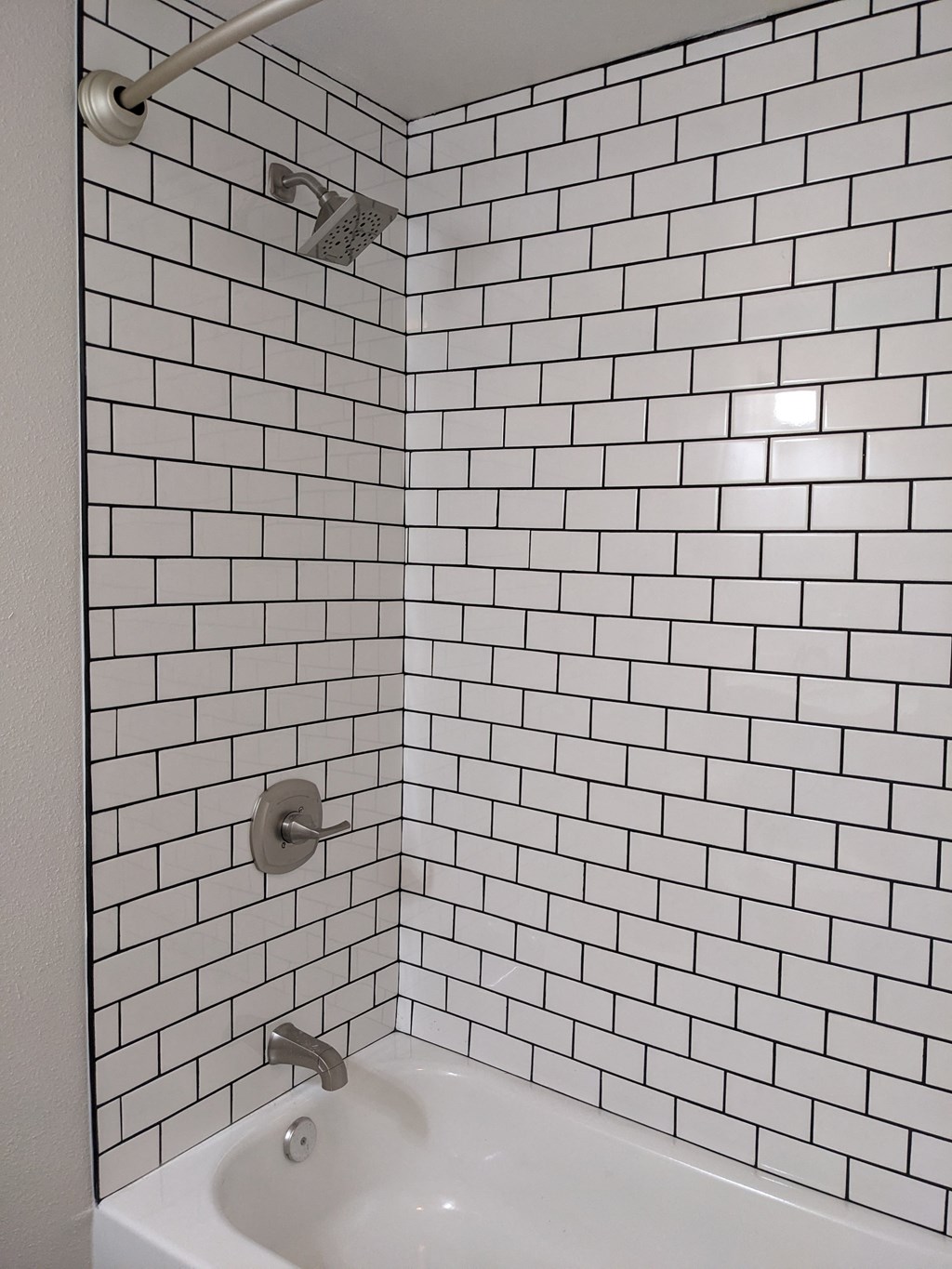 Subway tile in bathtub shower at The Hardison Apartments  in Pasadena, California.