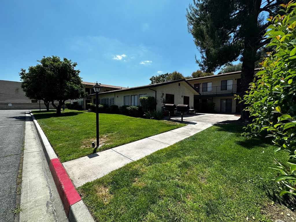 Community patio area with grills at Park Yale Apartments in Hemet, California.