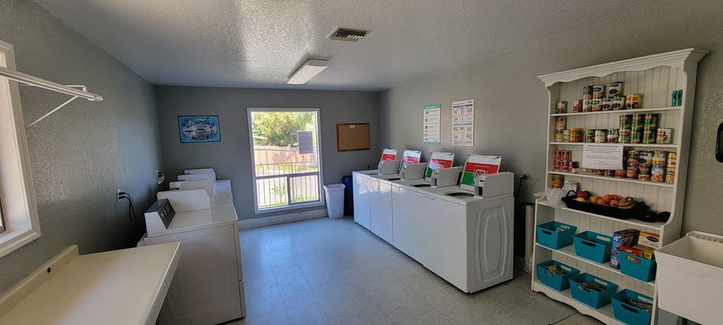 Laundry room and community pantry at Sierra Heights Apartments.
