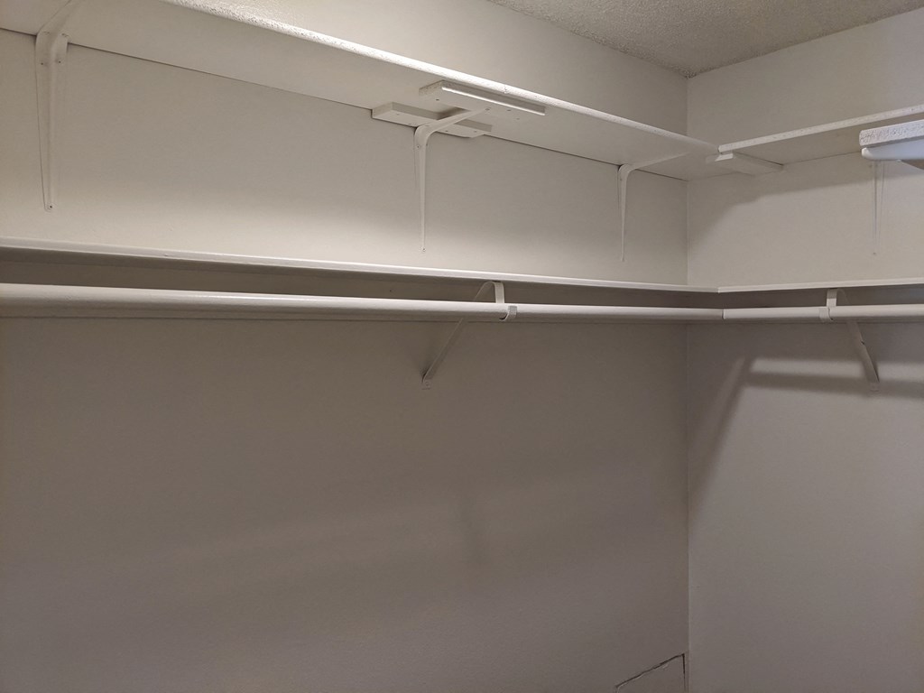 Bedroom walk-in closet at the Steckel Apartments in Santa Paula, California.