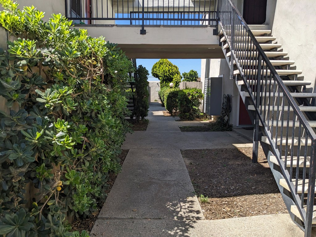 Walkway between buildings at the Steckel Apartments in Santa Paula, California.