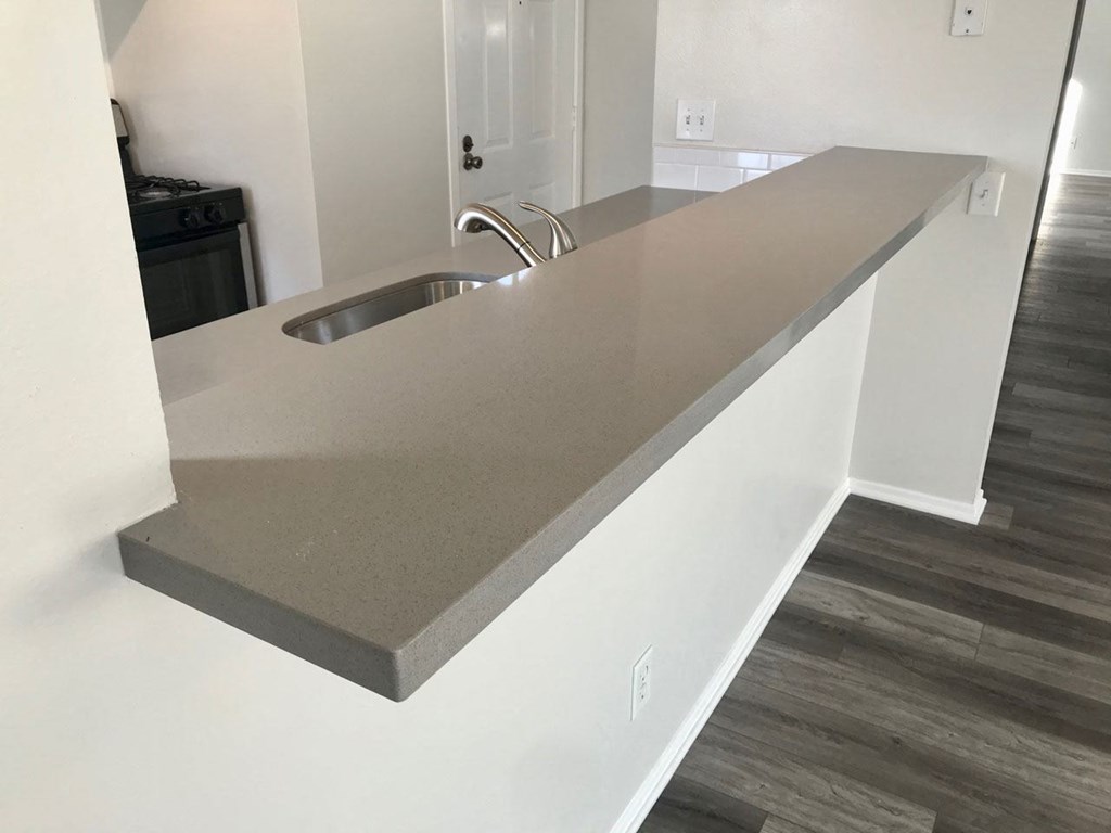 Lots of counter space in open kitchen at Summer House Apartments in Ventura, California.