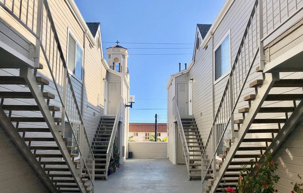 Walkway between buildings at Summer House Apartments in Ventura, California.