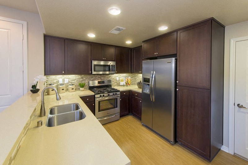 Kitchen in Surfside unit at Costa Pointe Luxury Townhomes in Carlsbad, California.