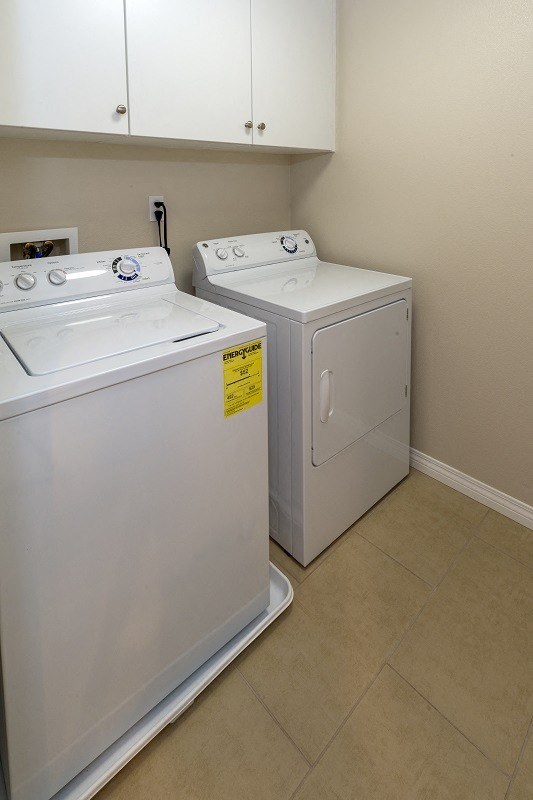 Second floor laundry room in Surfside unit at Costa Pointe Luxury Townhomes in Carlsbad, California.