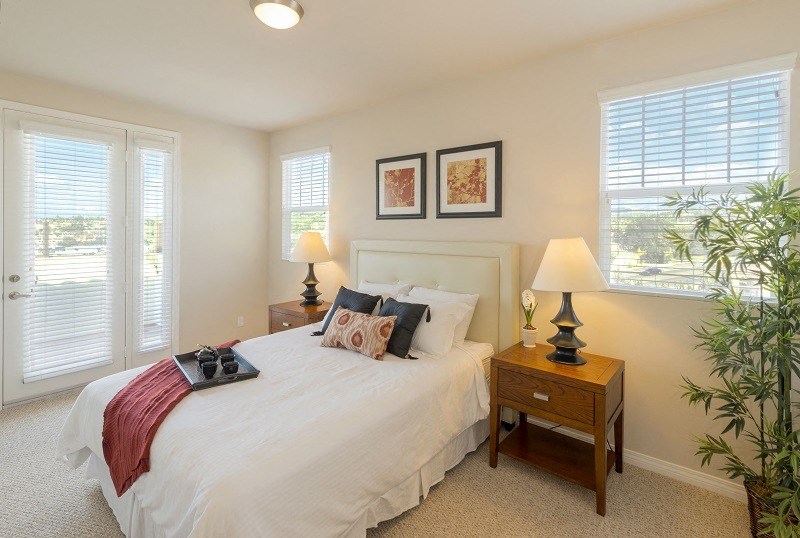 Surfside master bedroom at Costa Pointe Luxury Townhomes in Carlsbad, California.