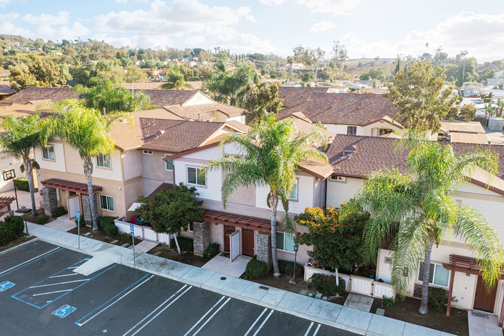 Arial view of parking lot and several units at The Nines Townhomes in Escondido, California.
