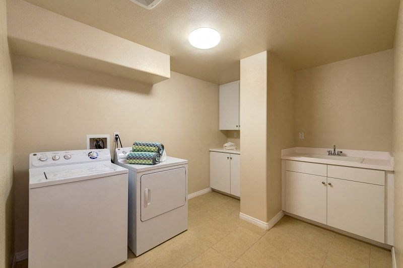 Fully equiped laundry room in Torrey unit of Costa Pointe Luxury Townhomes in Carlsbad, California.