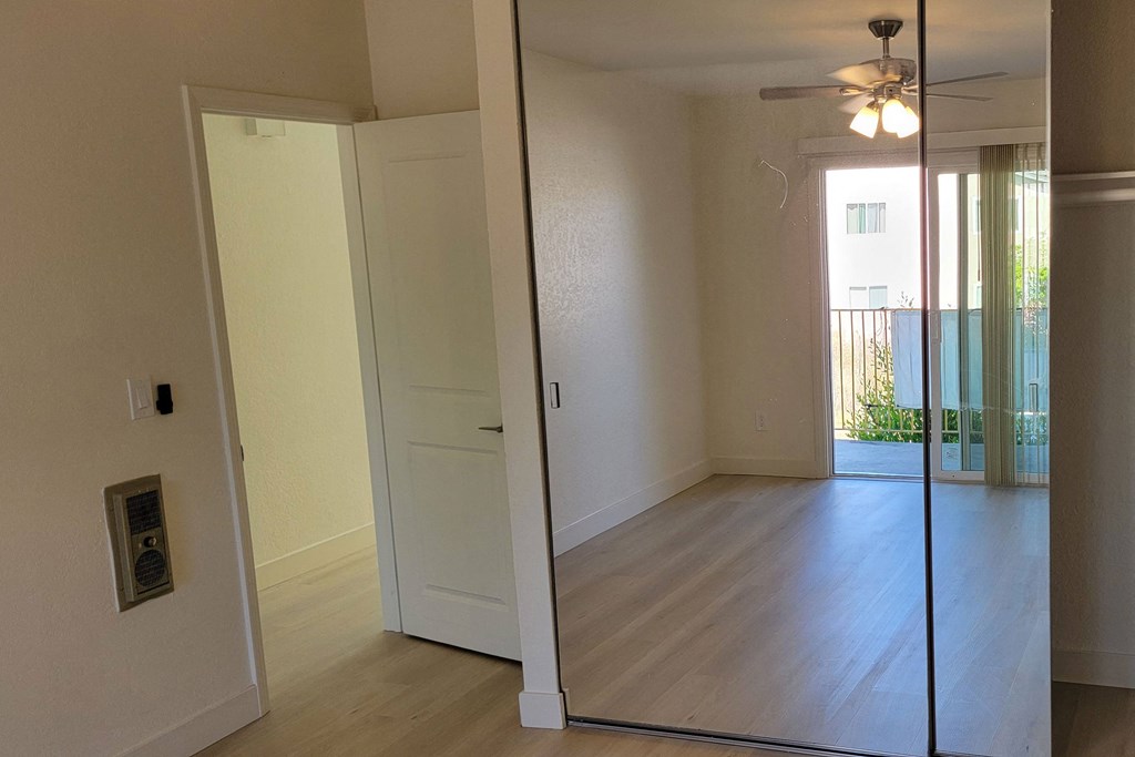 Bedroom two large closets in unit 17 at The Willows at Washington apartments in El Cajon, California.