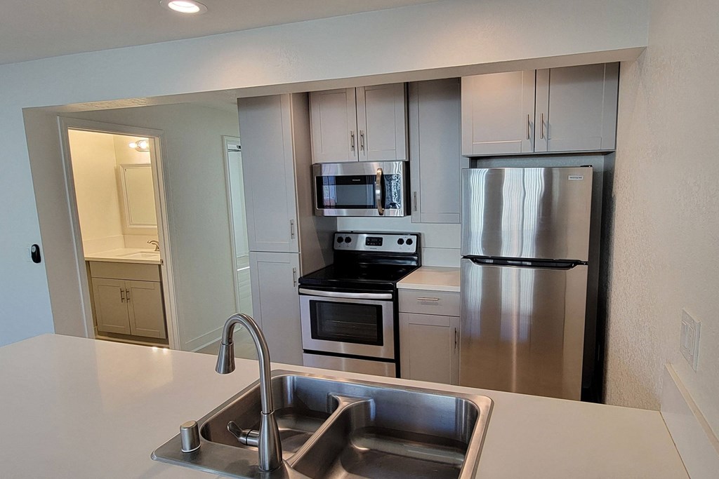 View of kitchen and bath enterance in unit 21 at The Willows at Washington in El Cajon, California.