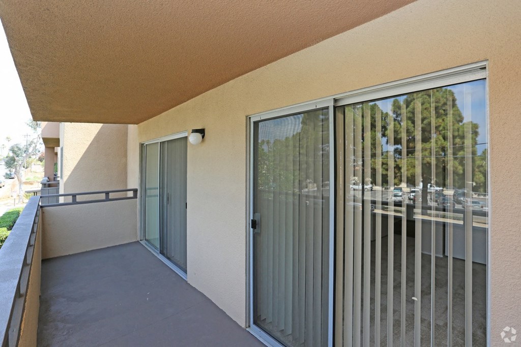 Private balcony with access from master bedroom and livingroom at Villa Pacific Apartments in Oceanside, California.