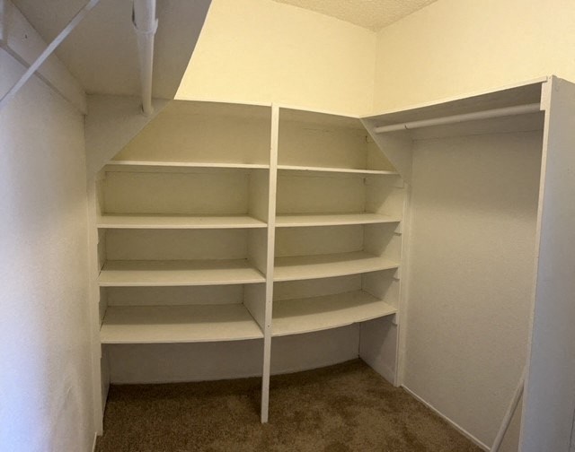 Master bedroom walk-in closet at Mission Bell Apartments.