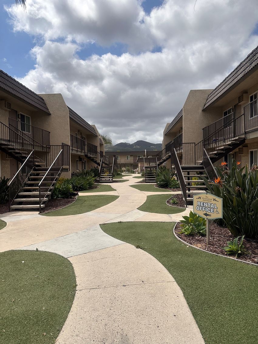 Walkway between buildings at The Meadowlark Apartments in San Marcos, CA. - Photo Gallery