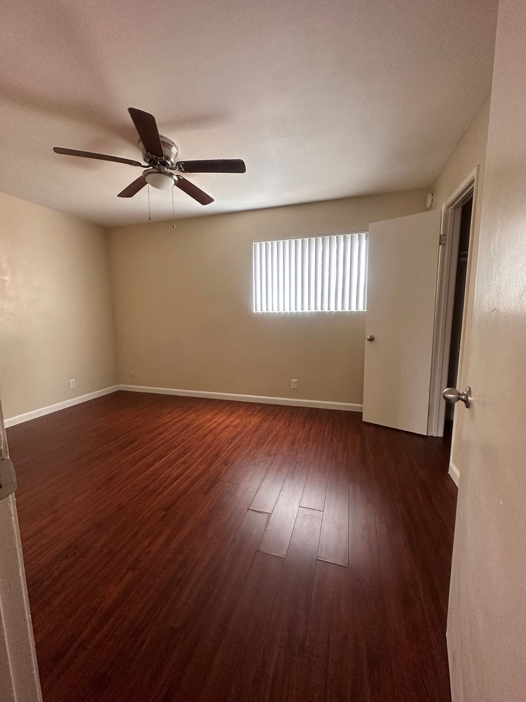 Ceiling fan and hardwood floors at The Meadowlark Apartments in San Marcos, CA.