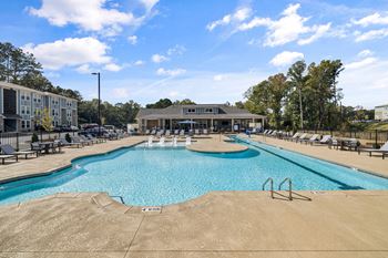 our apartments have a large swimming pool with lounge chairs