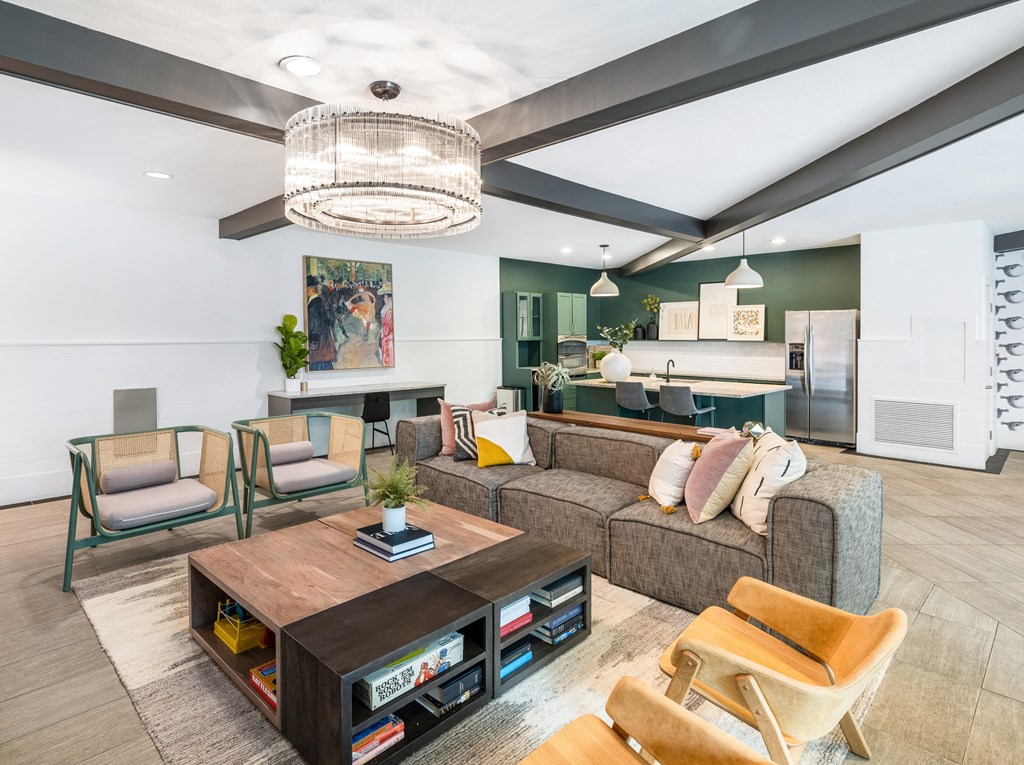 a living room filled with furniture and a large chandelier