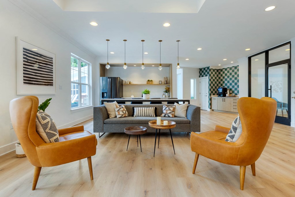 a living room with white walls and hardwood flooring