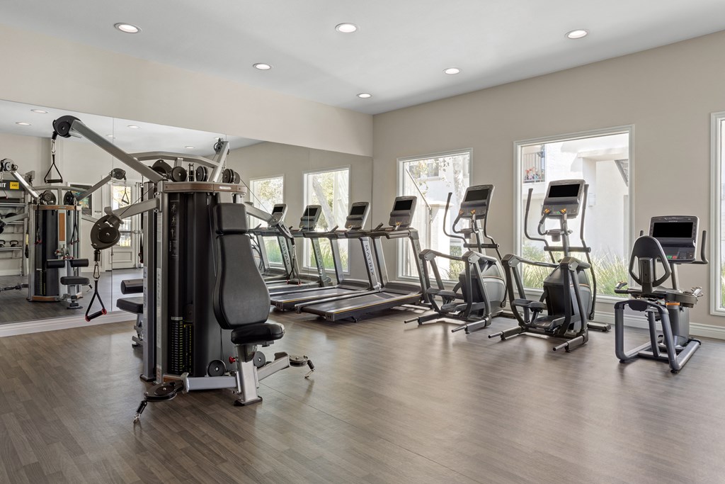 a room filled with lots of cardio equipment and exercise machines