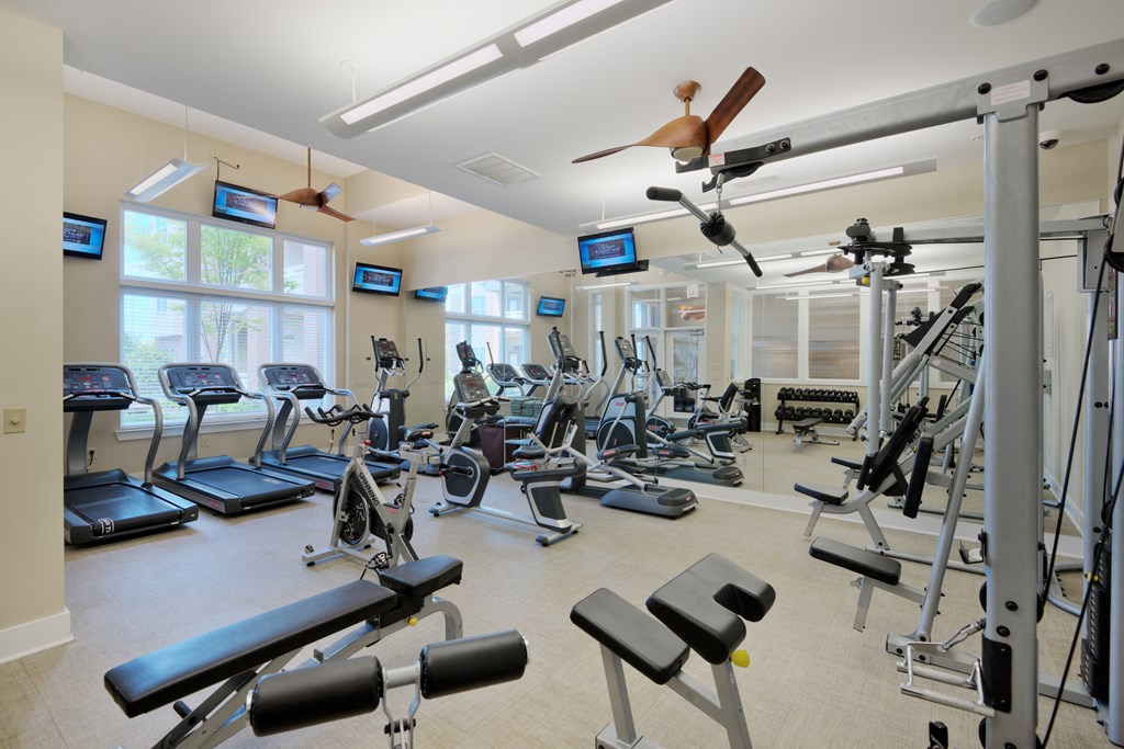a room filled with lots of different types of exercise equipment