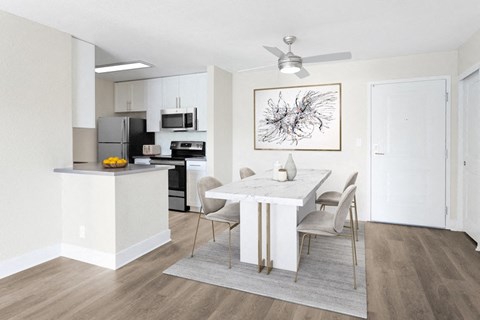 a dining room with tables around it and a picture frame