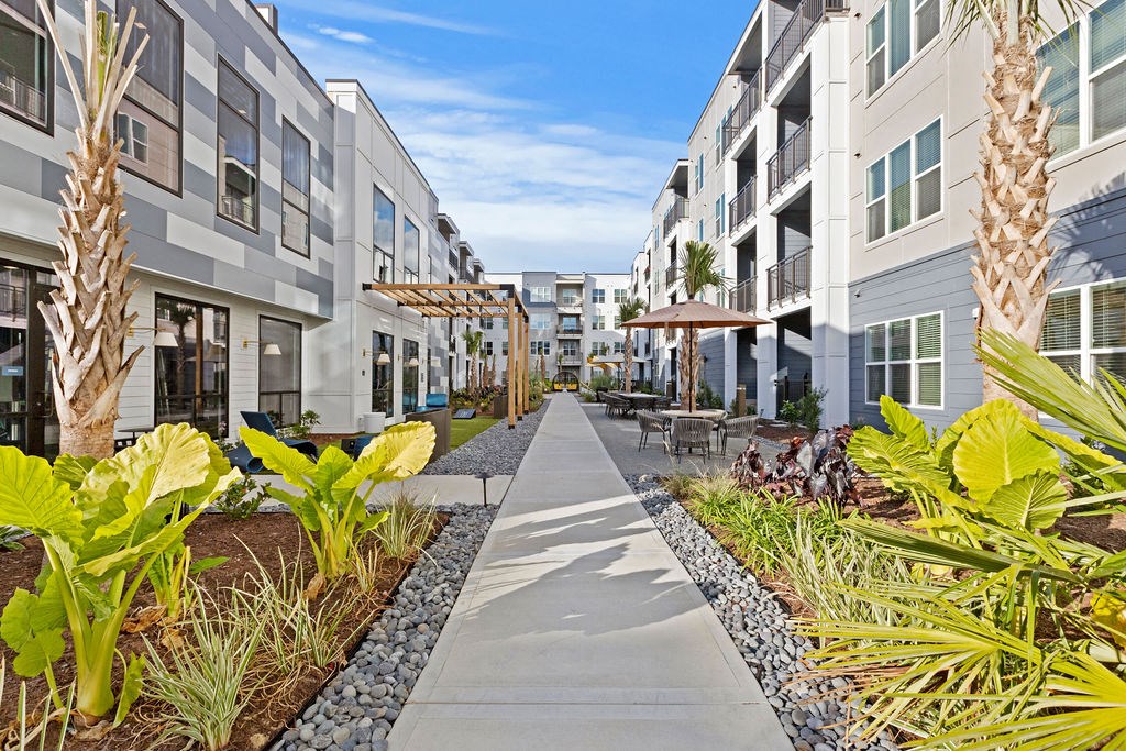 Courtyard Walkway with Greenery and Seating