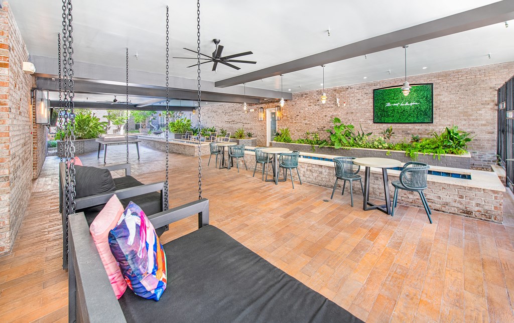 a seating area with a couch and chairs