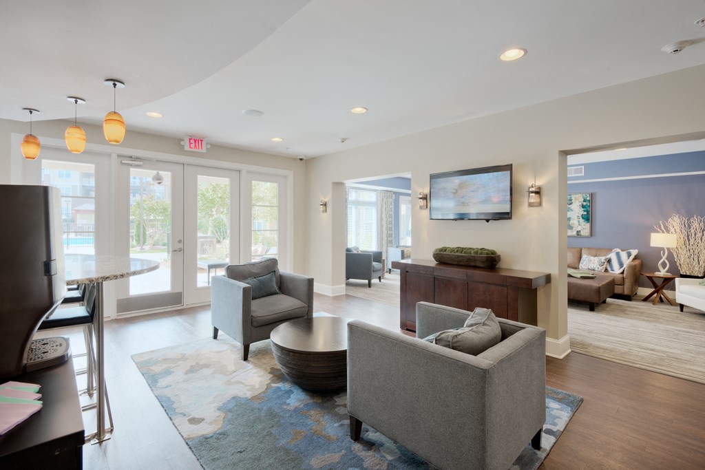 a living room filled with furniture and a flat screen tv