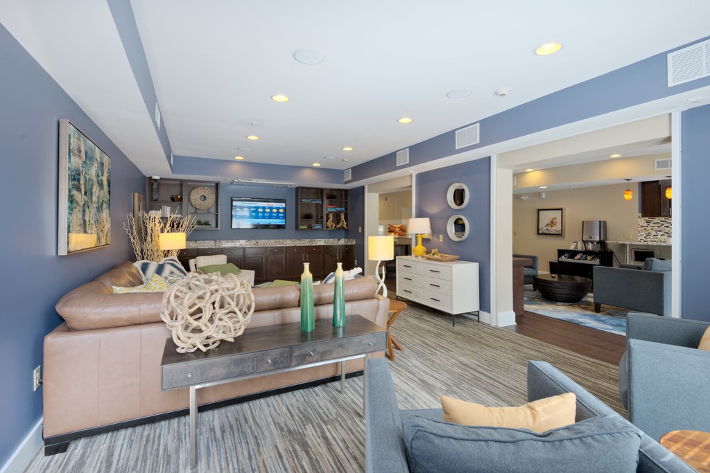 a living room filled with furniture and a large window